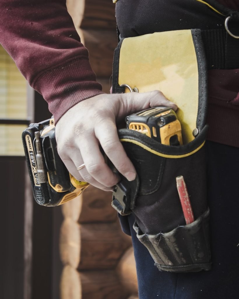 Photo by James Kovin person holding black and yellow nike gloves